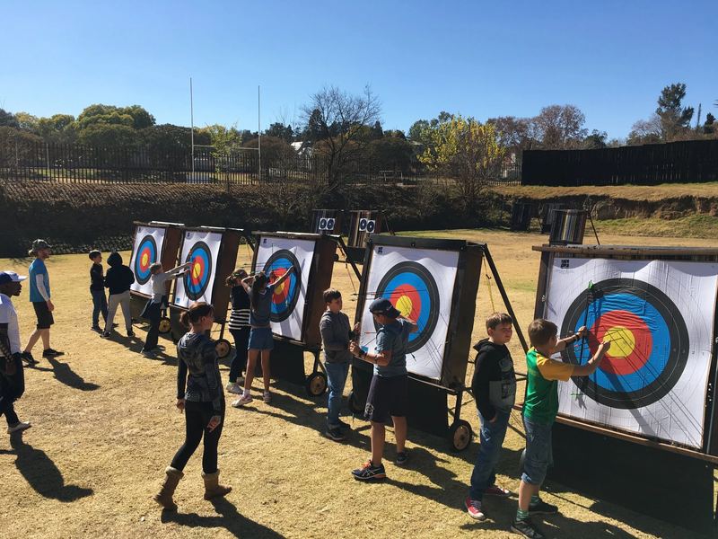 Archers walking up to score their arrows